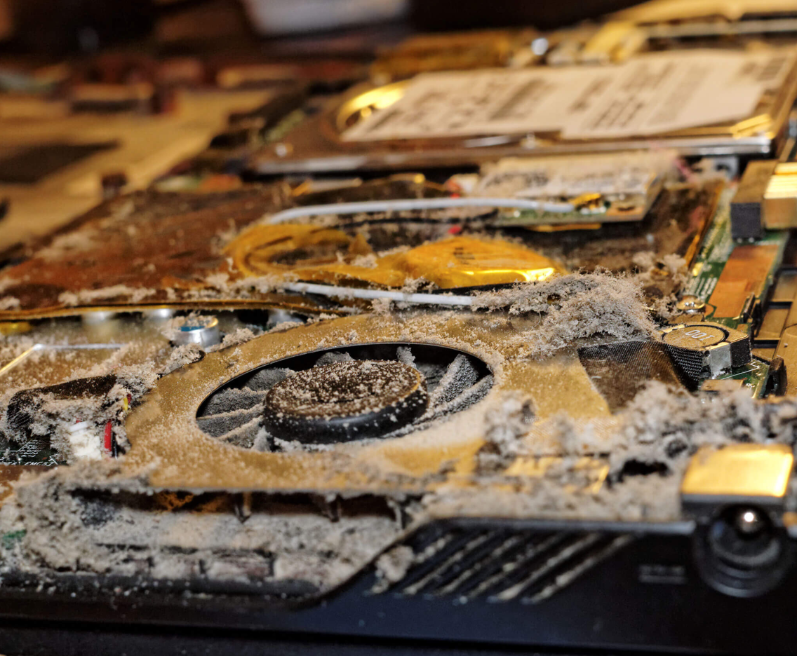 computer overheating repair Los Angeles technician cleaning laptop fan