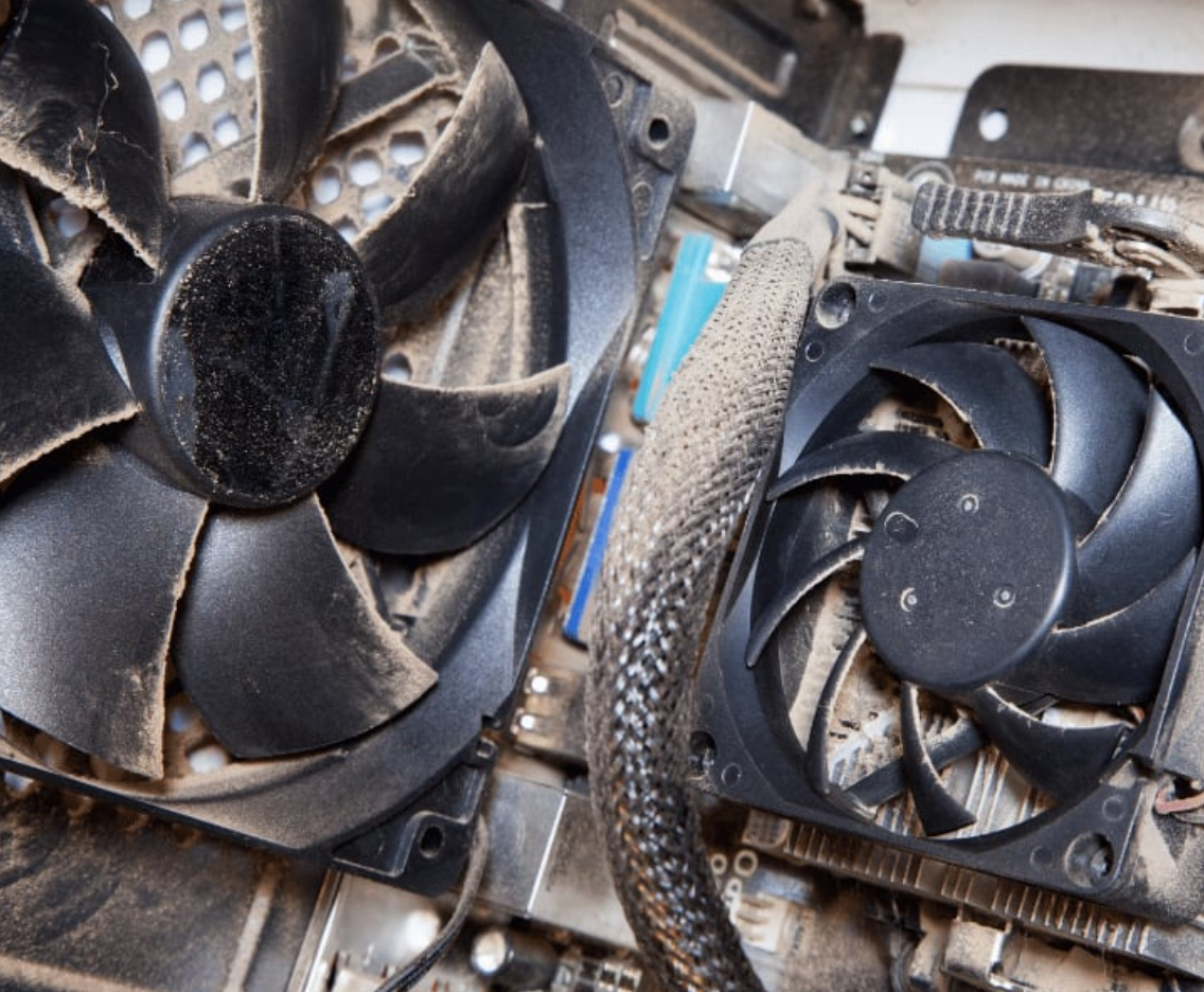 Dusty computer fan causing grinding noise and overheating issues requiring computer making noise repair